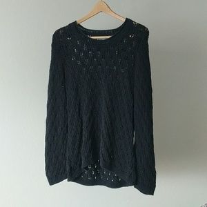 Large black hole woven sweater